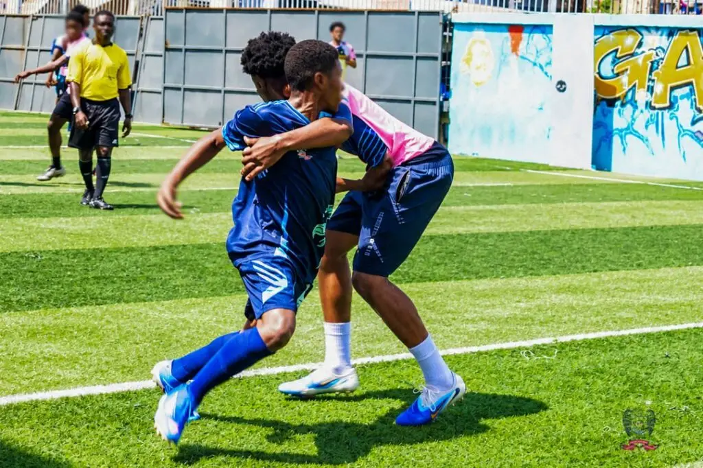 ASD student football players competing for possession during a DISSAC football match in Douala, Cameroon.