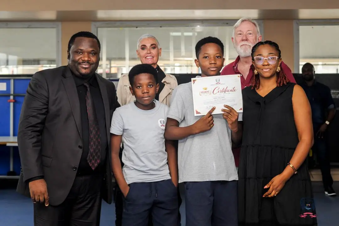 ASD student receives October Student of the Month certificate during a creativity and academic excellence celebration in Douala.