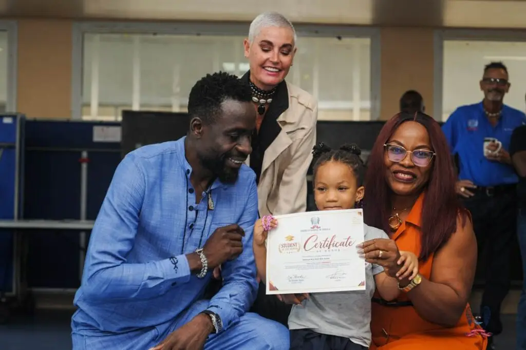 American School of Douala student celebrates an October Student of the Month award alongside members of the school community