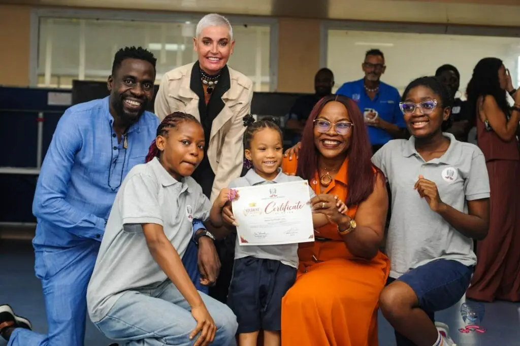American School of Douala student celebrates an October Student of the Month award alongside members of the school community