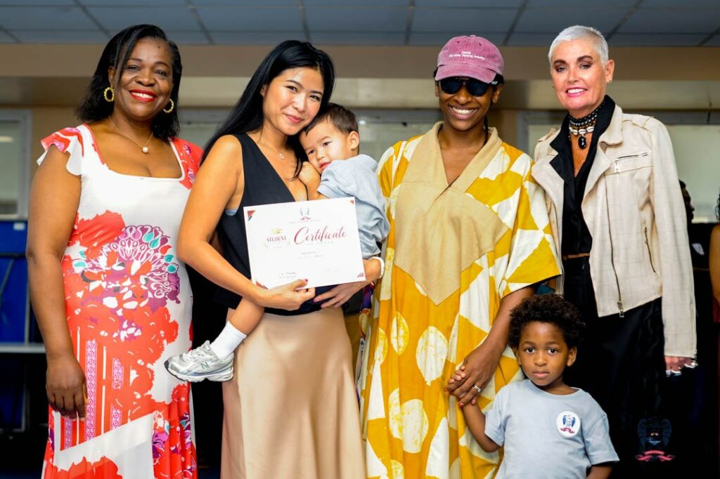 American School of Douala student celebrates an October Student of the Month award alongside members of the school community